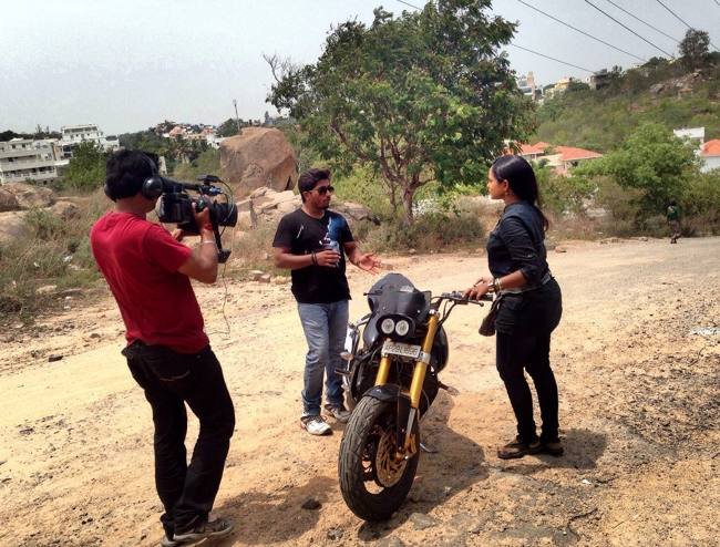 TV5 news crew filming an interview about bike modification in Hyderabad, June 2014